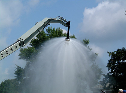 A 50-foot wide broken spray water curtain extinguishes fires upon contact.